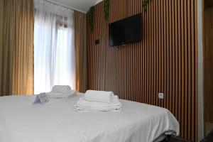 Postel nebo postele na pokoji v ubytování Apartmani Drijen