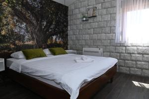Postel nebo postele na pokoji v ubytování Apartmani Drijen