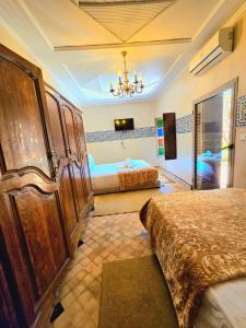 A bed or beds in a room at Riad Rime Garden Marrakech