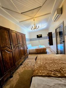 A bed or beds in a room at Riad Rime Garden Marrakech