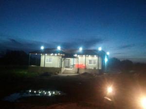 a small house with lights on it at night at الاردن in Jurf ad Darāwīsh