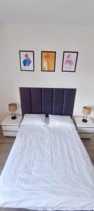 Ένα ή περισσότερα κρεβάτια σε δωμάτιο στο Apartament Rodzinny II