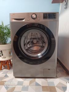 a washing machine is sitting in a room at Habitaciones Gioly in Puerto del Rosario