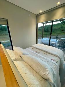 Postel nebo postele na pokoji v ubytování Container - Gruta Bom Sucesso - Moradas da Serra