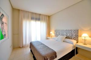Posteľ alebo postele v izbe v ubytovaní Aparthotel Novo Resort