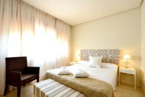Posteľ alebo postele v izbe v ubytovaní Aparthotel Novo Resort
