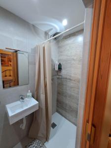 a bathroom with a sink and a shower at Floriana One Bedroom Studio House in Il-Furjana