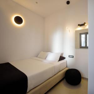 Postel nebo postele na pokoji v ubytování Tataki Family Hotel