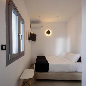Postel nebo postele na pokoji v ubytování Tataki Family Hotel