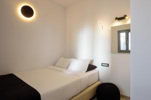 Postel nebo postele na pokoji v ubytování Tataki Family Hotel