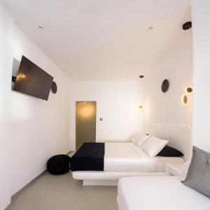 Postel nebo postele na pokoji v ubytování Tataki Family Hotel