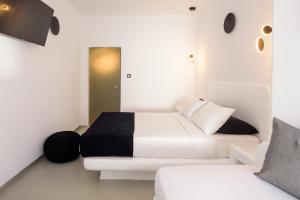 Postel nebo postele na pokoji v ubytování Tataki Family Hotel