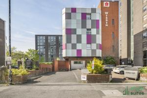 a building with a cube on the side of it at Flat in Old Trafford Manchester in Manchester