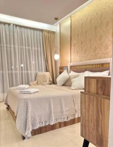 a bedroom with a large bed in a room at Luxury apartment Malabata in Tangier