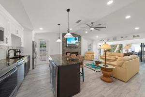 a kitchen and living room with a counter top at Tipsy Turtle in Sanibel