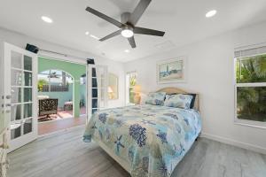 a bedroom with a bed and a ceiling fan at Tipsy Turtle in Sanibel