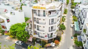 an overhead view of a white building with a sign on it at Lucasta Hotel in Can Tho +108 photos