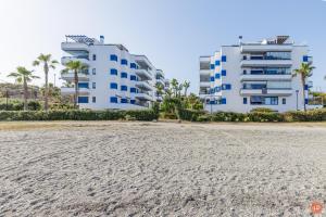 a view of two buildings from the beach at Views of the Blue in Torrox