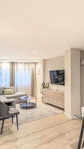 Μια τηλεόραση ή/και κέντρο ψυχαγωγίας στο Luxury apartment in Pontevedra