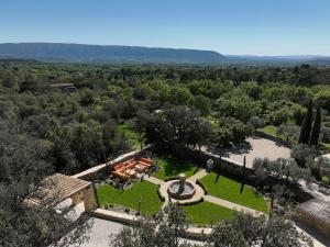 an aerial view of a mansion with a garden at La Borie Oubliée in Gordes