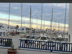 a marina with boats docked in a harbor at Duplex Monastir avec terrasse sur la marina in Monastir