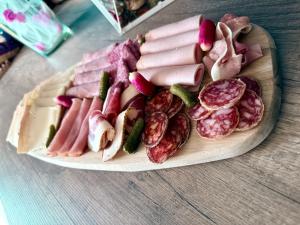 a plate of meats and vegetables on a table at Charda Spa in Seyne