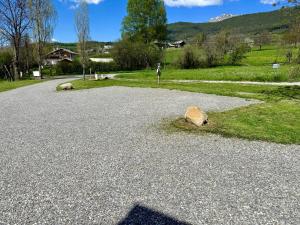 a rock sitting on the side of a gravel road at Charda Spa in Seyne
