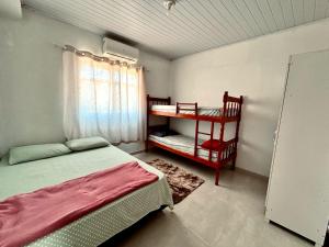 Postel nebo postele na pokoji v ubytování recanto provetá ILHA GRANDE