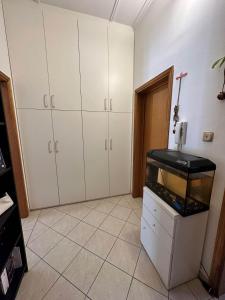 a room with a fish tank in a room at Leopardi 81 - 400 mt dall' AUTODROMO F1 in Imola +14 photos