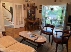 a living room with a couch and a table and chairs at Sleepy Hollow Manor in Gettysburg