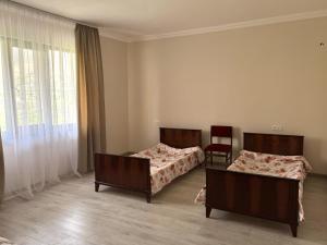Postel nebo postele na pokoji v ubytování Poqr Tagh
