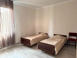 Postel nebo postele na pokoji v ubytování Poqr Tagh