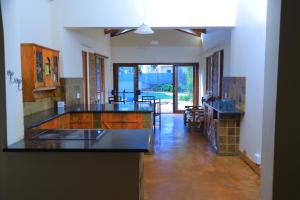 a kitchen with a sink and a counter top at Ivy at 6 Peace Sleep in Pretoria