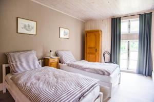 Rúm í herbergi á Apartment, Gîte chez MarEdo