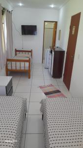 Postel nebo postele na pokoji v ubytování Hospedaria Casa de Maria