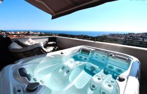 a bath tub sitting on top of a balcony at Dubrovnik Icy Guest House in Dubrovnik
