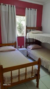 Postel nebo postele na pokoji v ubytování Hospedaria Casa de Maria