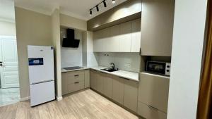 Η κουζίνα ή μικρή κουζίνα στο The Greens Apartment