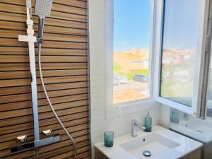 a bathroom with a shower and a sink at Villa T4, île de la marina, parking in Cap d'Agde +60 photos