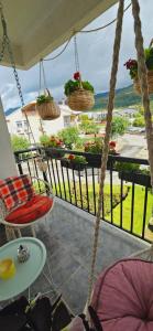 a balcony with a view of a garden at Jana's Apartment,100 meters to the lake,Free Parking in Ohrid