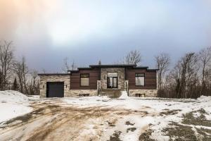 a house in the snow on a dirt road at NEW! Chalet Forena 4 Bedrooms in La Conception