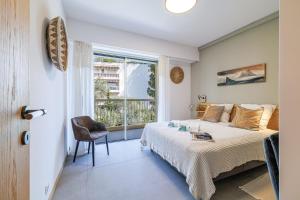 a bedroom with a bed and a window at GAIRAUT - 5 rooms - Terrass in Nice +39 photos