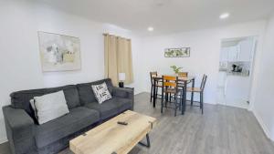 a living room with a couch and a table at Close to the beach #4 Cozy condo in Myrtle Beach