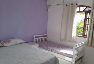 Postel nebo postele na pokoji v ubytování Hospedaria Casa de Maria