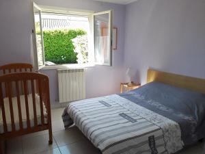 Postel nebo postele na pokoji v ubytování Villa Madura - Classée 3 étoiles - Confort et bien-être à 2 pas des commodités et de l'Hérault