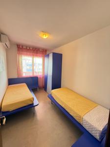 Postel nebo postele na pokoji v ubytování Residence Luna