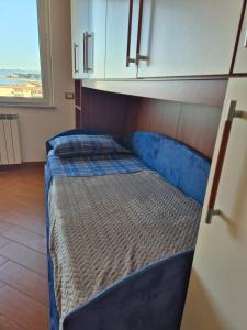 a bedroom with two beds in a room with a window at Appartamento La Casetta in Varazze