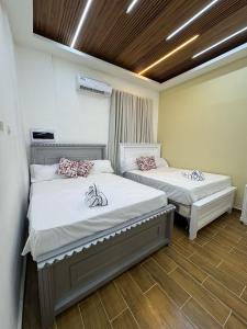 Ένα ή περισσότερα κρεβάτια σε δωμάτιο στο Villas Las Indigenas +57 φωτογραφίες