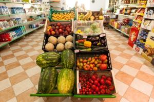 a display of fruits and vegetables in a grocery store at Camping & Residence Il Pioppeto in Vasto