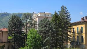 a group of trees in front of a building at Casa Amabile in Como